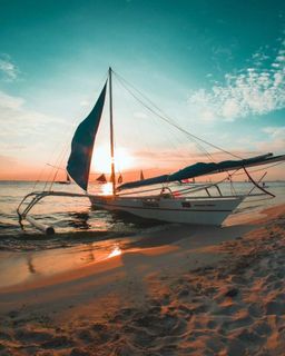 Outrigger boat beached ashore