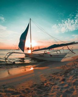 Outrigger boat beached ashore