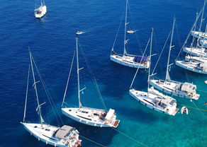 Sailboats shore moored in Greece