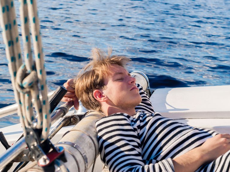 Sailor sleeping on a boat