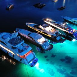 Luxury yachts anchored in Mykonos at night