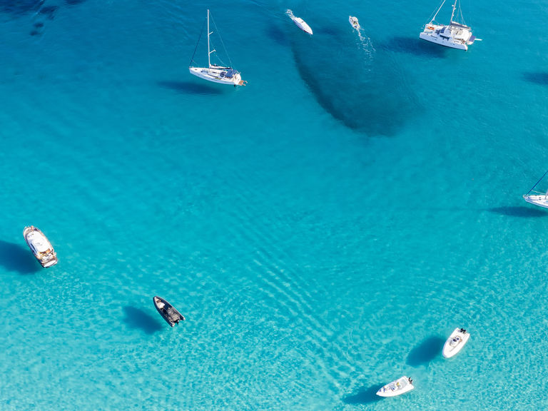 Nots at anchor in turquoise water panoramic view